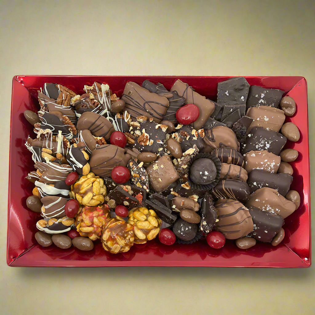 Small red metal tray with a collection of confections