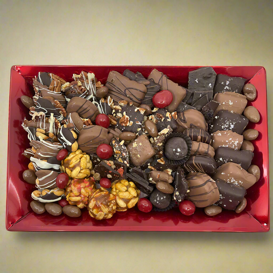 Small red metal tray with a collection of confections